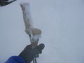 Snow stuck to everything, even my pole handles (that's my car in the background, snow up to the grille)